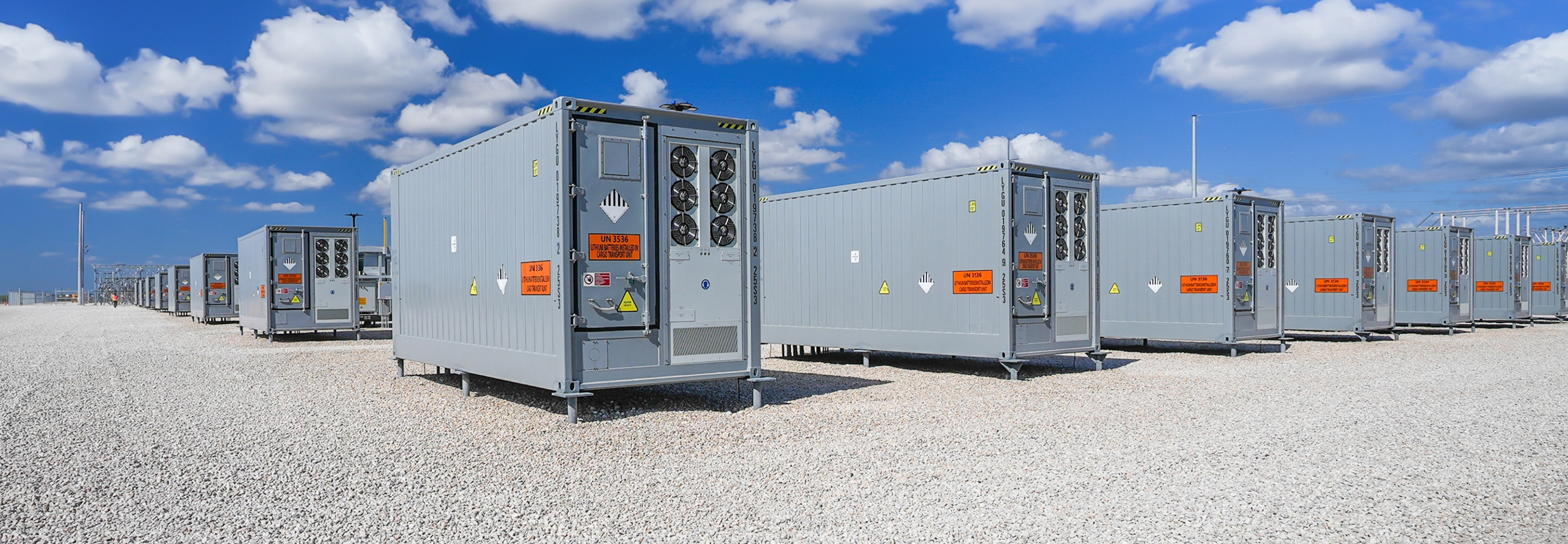 Grid-scale battery energy storage system with modular container units.