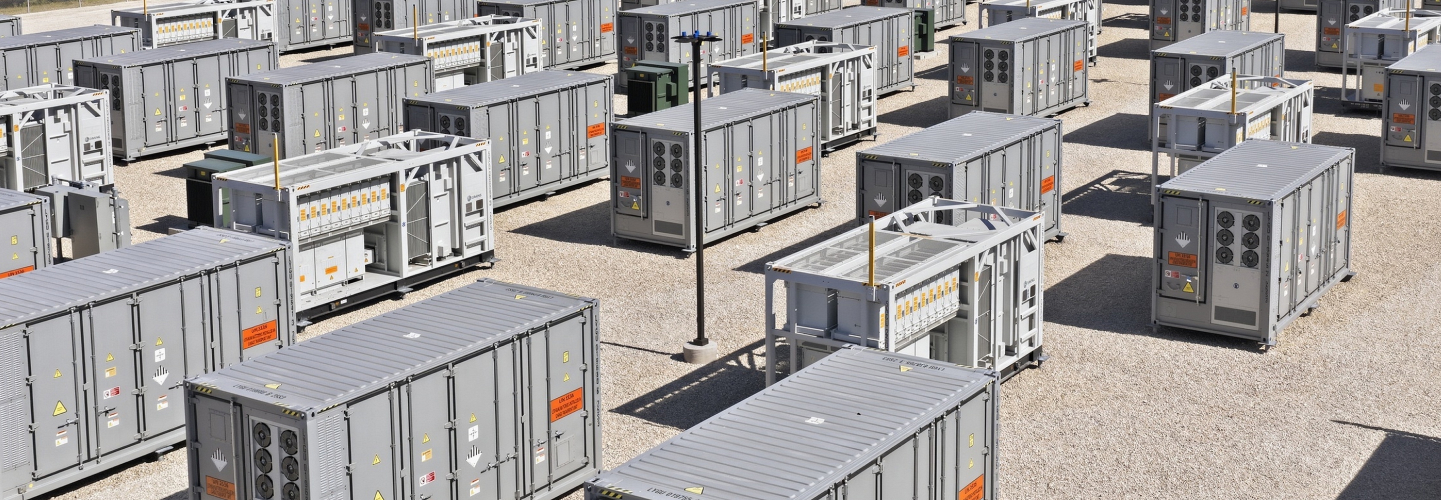 Grid-scale battery energy storage system with modular container units.