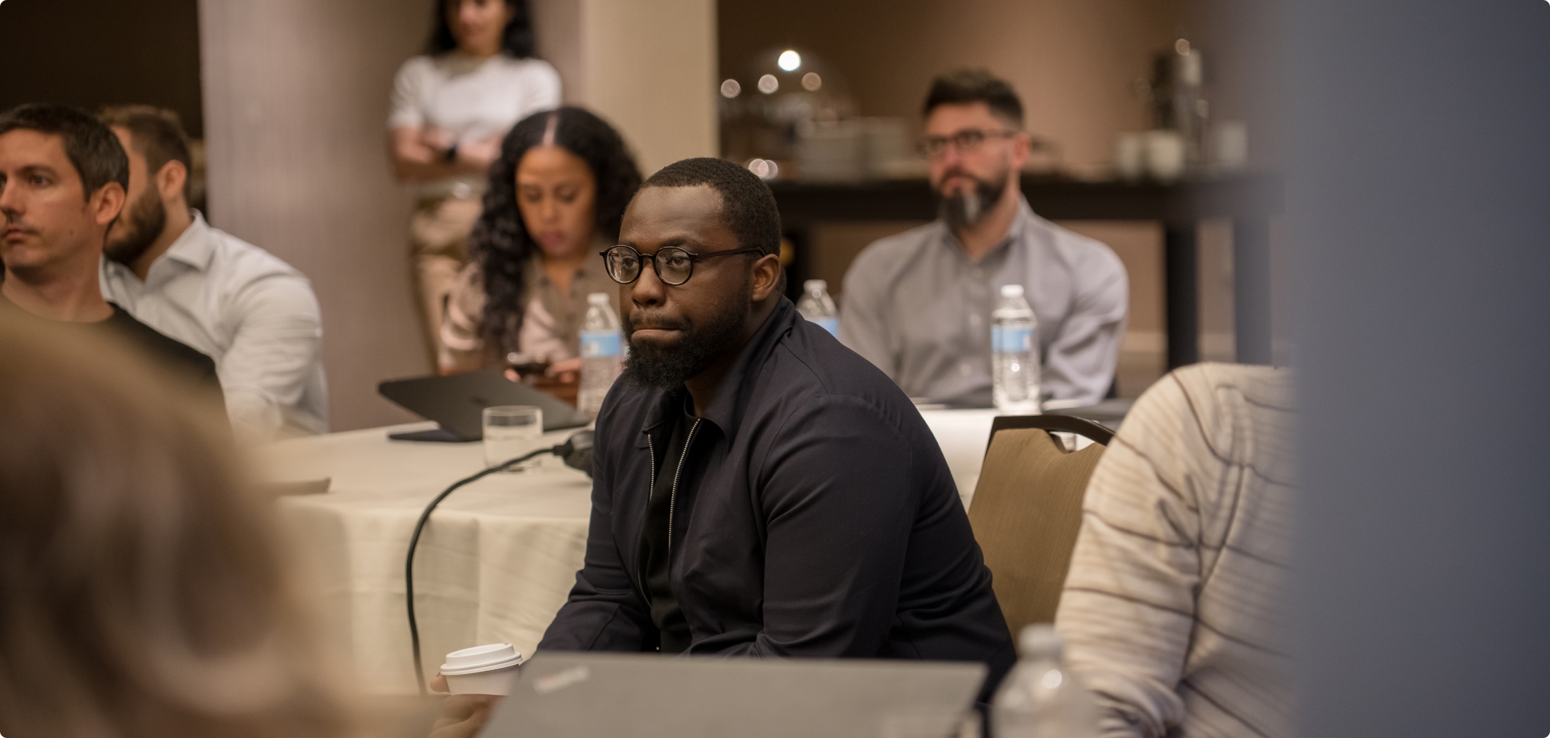 Lydian team member participating in a company meeting.