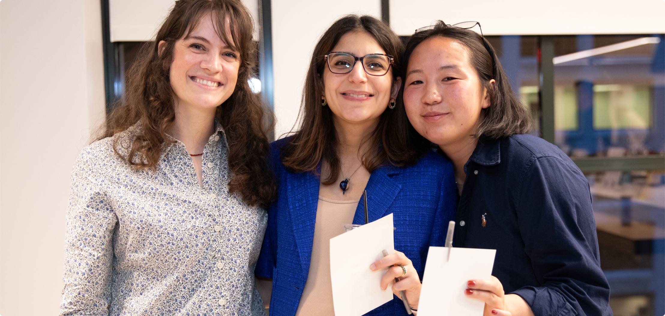Three Lydian team members together at a company event.