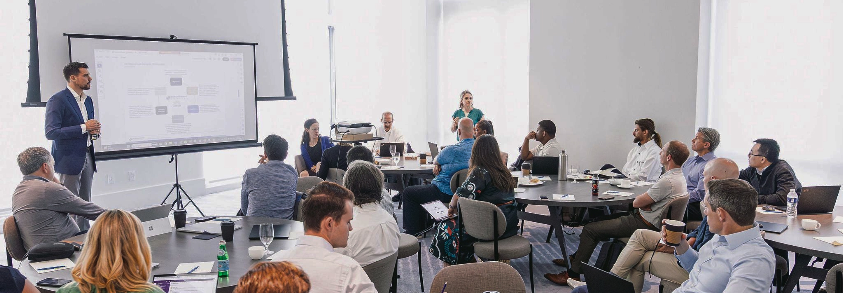 Lydian team members participating in a company presentation and workshop.