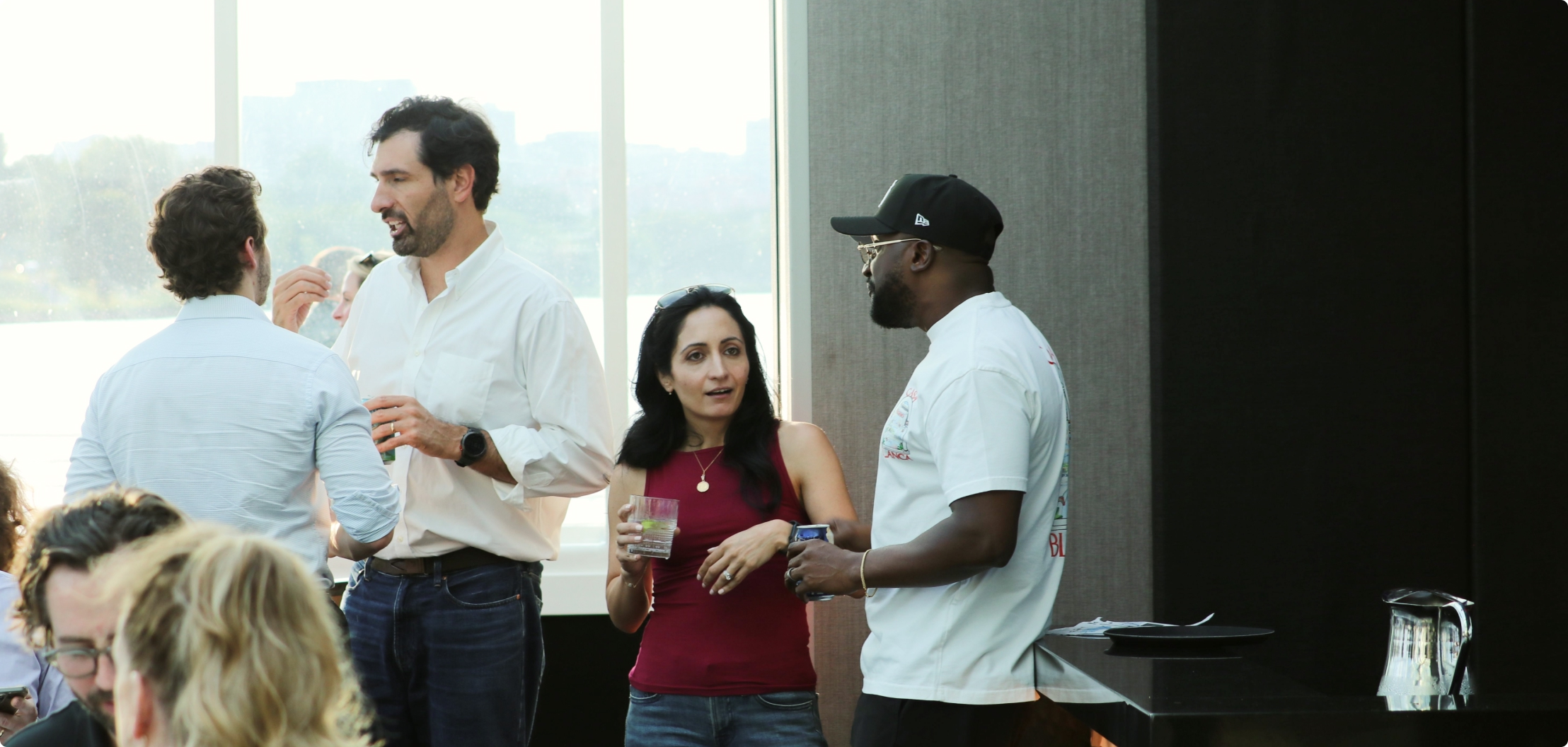 Lydian team members socializing during a company event.