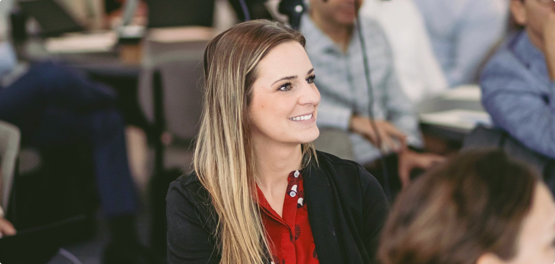 Lydian team member participating in a company meeting.